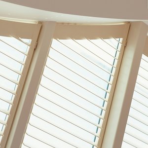 white-wood-conservatory-shutters