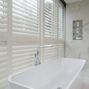white-sliding-shutters