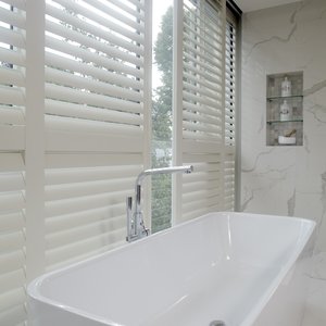 white-bathroom-sliding-shutters