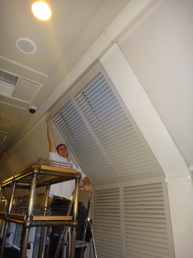 Carpenters installing the shutters