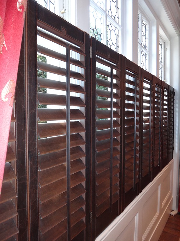 Bespoke shutters in a distressed faux leather finish